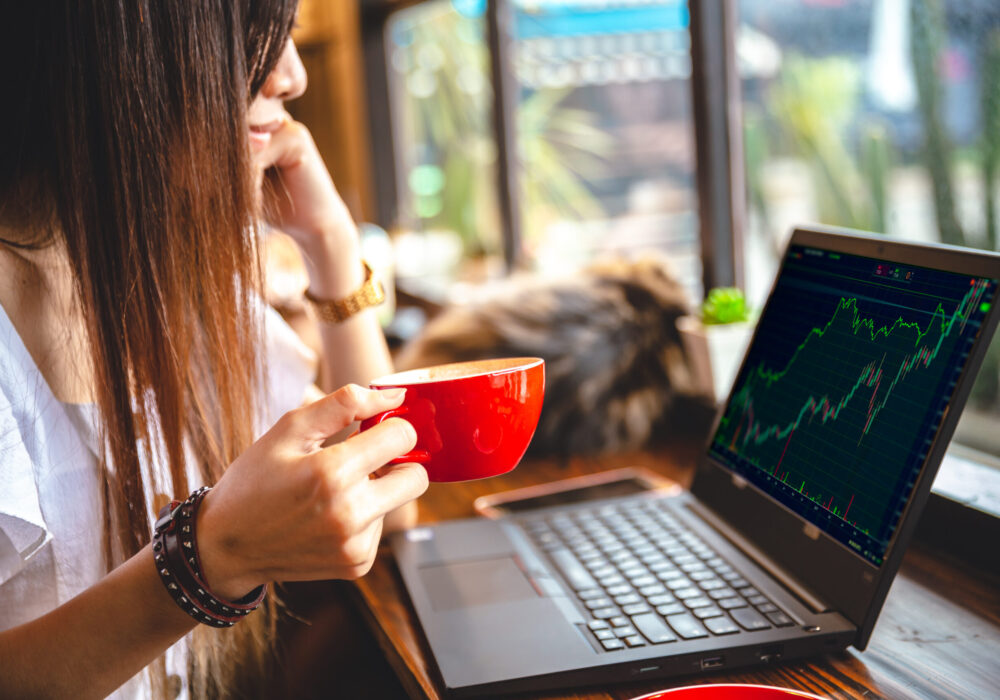 Intraday stock trader businesswoman working at coffee shop bar for business cafe hopper lifestyle. Intraday stock trader businesswoman working at coffee shop bar for business cafe hopper lifestyle.
